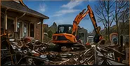 Excavator completing demolition and site preparation